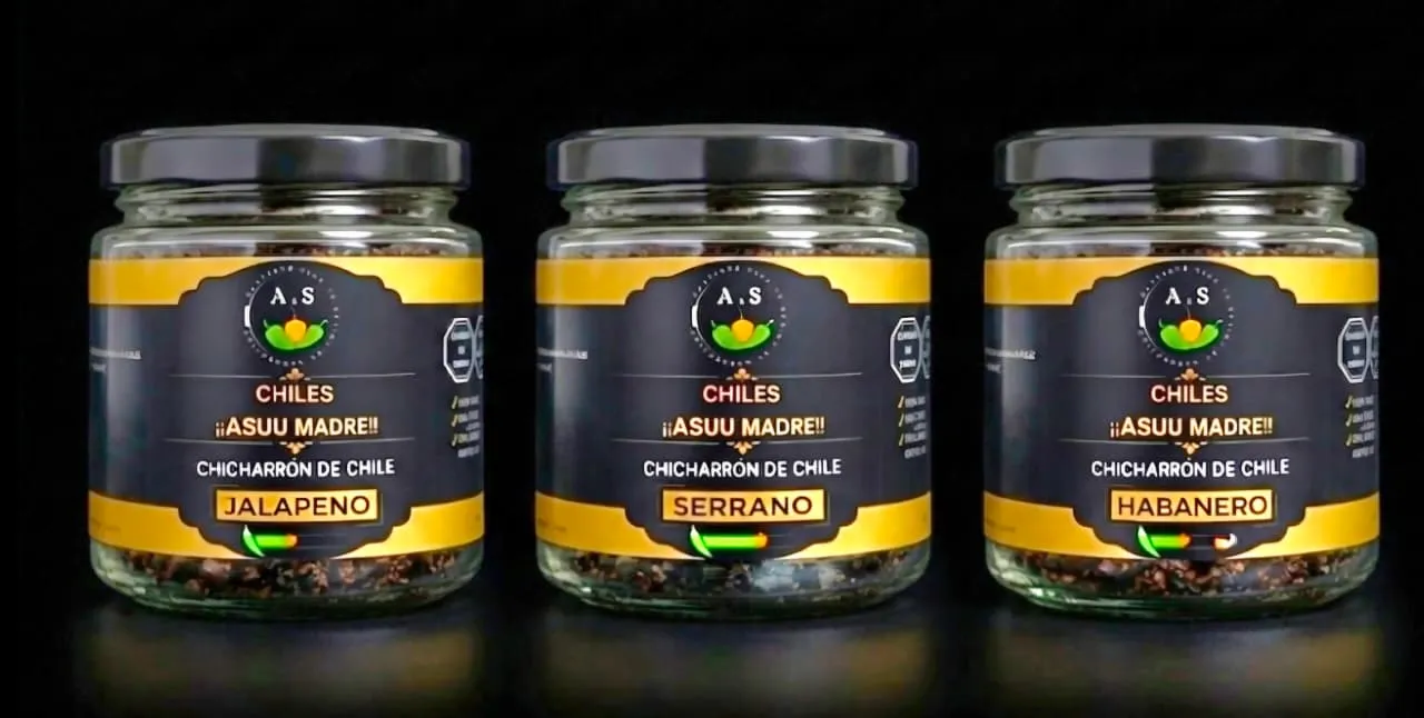 The three jars of Sabores chili crunch lined up together, showing the variety of colors from green to red, professional studio product shot